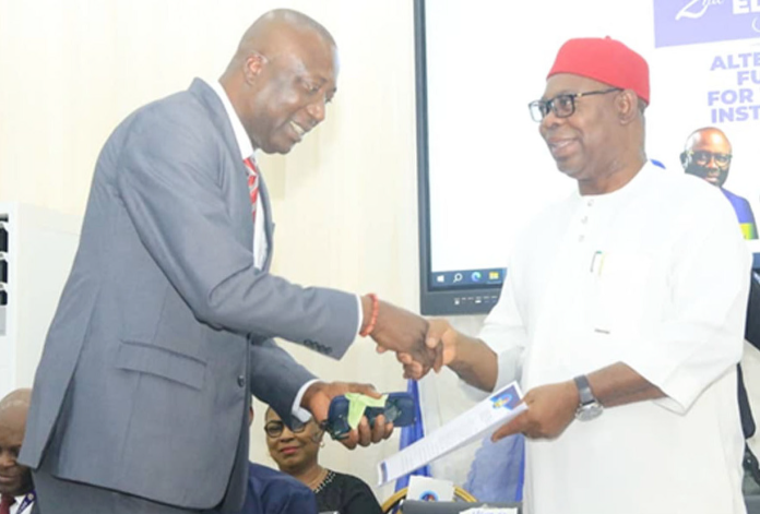 The representative of Delta State Governor and Deputy Governor of the State, Sir Monday Onyeme (right), and the State Commissioner for Higher Education, Prof. Tonukari Nyerhovwo, during the 2nd Edition of the Education Summit, held at Dennis Osadebe University, Asaba