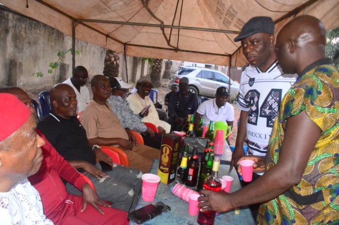 R-L : Delta State youth leader, Barrister Francis Okolie standing in the middle exchanging pleasantries at the end of year get- together for youths and PDP supporters in Aniocha South LGA