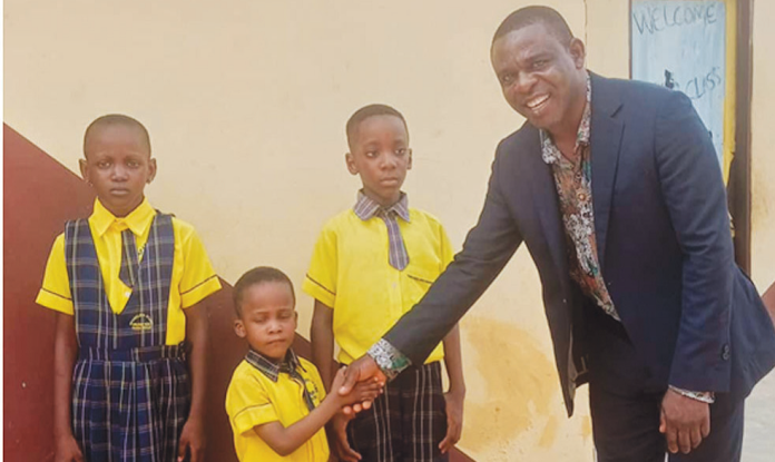 Senior Pastor of Covenant Family Church, Pastor Blossom Uzogo and pupils of Sparkling Stars Group of Schools, Asaba, when he visited the school for evangelism.