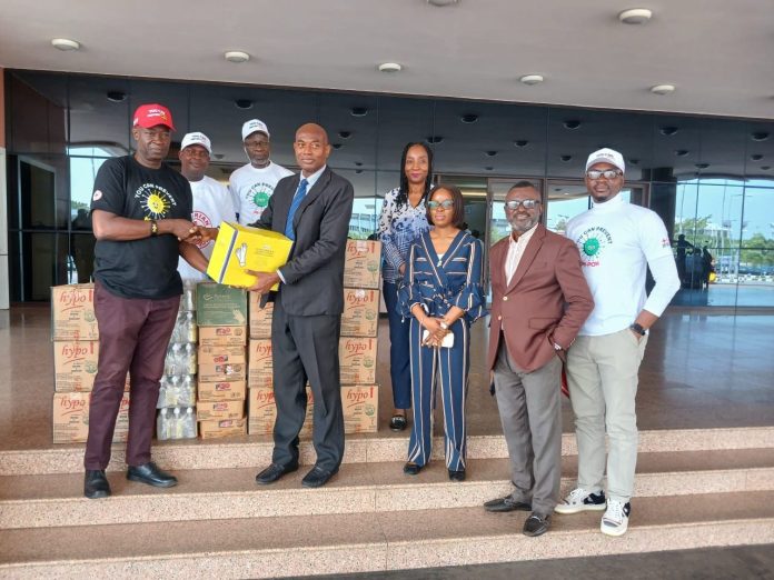 The Chairman Nigerian Red Cross Society (NRCS) Delta State Branch,, TR. Adolphus Anuagasi (left) presenting Infection Prevention Control (IPC) Materials to The Permanent Secretary Delta State Ministry of Health Dr. Philomena Okeowo represented by the Director Department of Medical Services, Dr Chris Iwegbu, and others. During the one day town Hall/Stakeholders meeting held in Asaba.